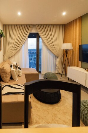 Deluxe Apartment, Balcony, City View | Living area | Flat-screen TV - NOVA-BlueWaters Property Management (Accra)