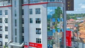 A modern building with a sign reading "ZURI PLACE" and "ZURI HOTEL". - Zuri Place Hotel (Oyugis)