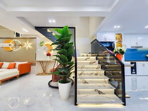 Deluxe Room, Balcony, City View | Handrails in stairways