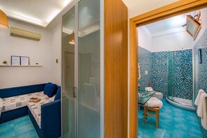 Junior Suite | Living area | 36-inch flat-screen TV with digital channels