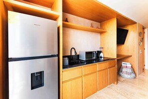 Fridge, microwave, stovetop, coffee/tea maker
