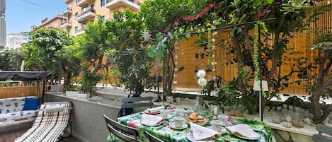 Family Apartment, Multiple Bedrooms (Casa Amorosa Town Center) | Outdoor dining