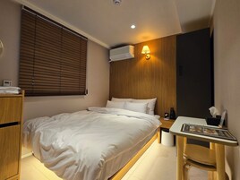 Premium bedding, memory-foam beds, desk, laptop workspace