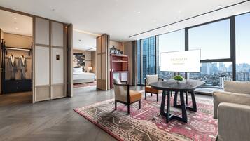 Premier Suite King | Living room | 65-inch LED TV with cable channels