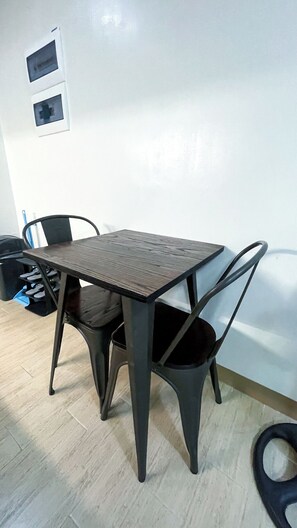 Shared Dormitory, 1 Bedroom, Balcony, Pool View | Dining - Room-modern Haven for Work & Leisure (Iloilo)