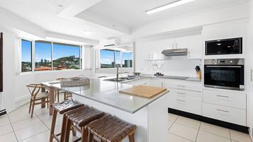 Two Bedroom Pool View Apartment | Private kitchen | Electric kettle, dining tables