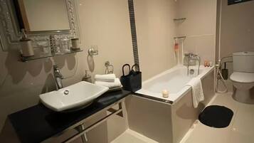 Shower, hair dryer, bidet, towels