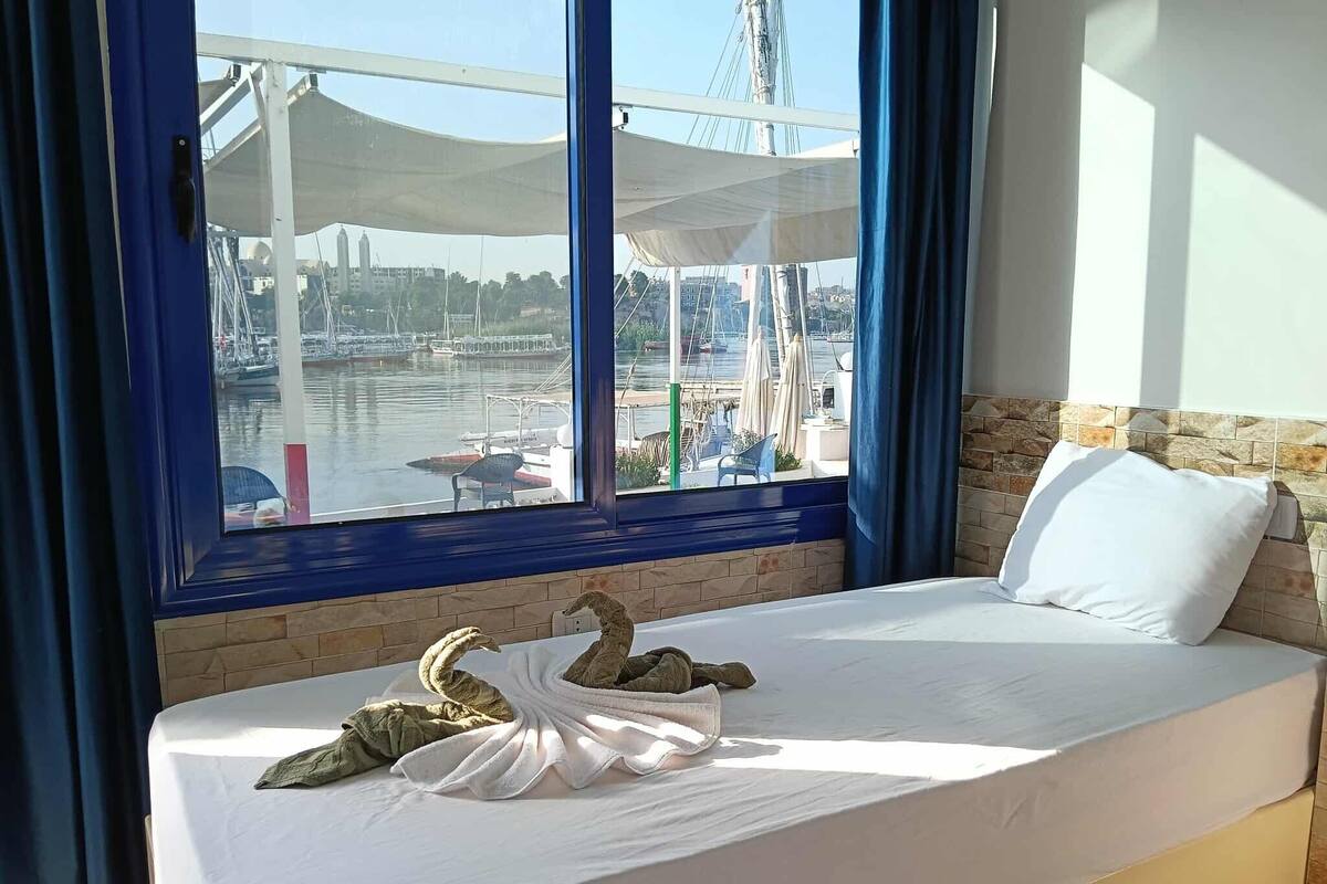 Triple Room, Patio, River View | Blackout drapes, free WiFi