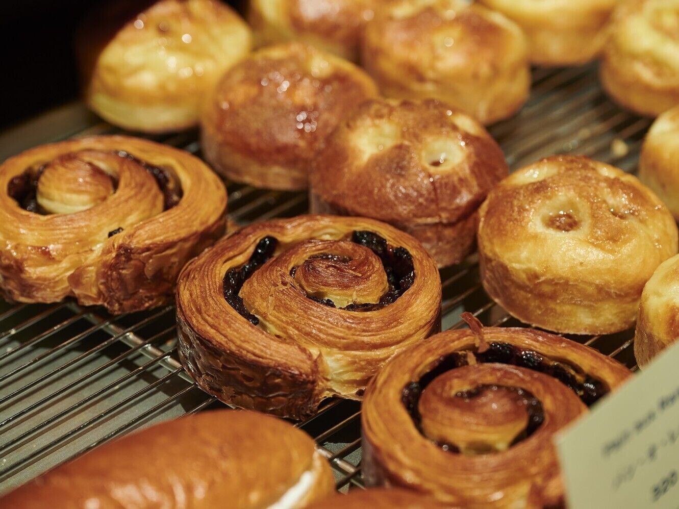 A display of pastries, likely in a bakery or cafe setting.