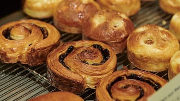 A display of pastries, likely in a bakery or cafe setting.