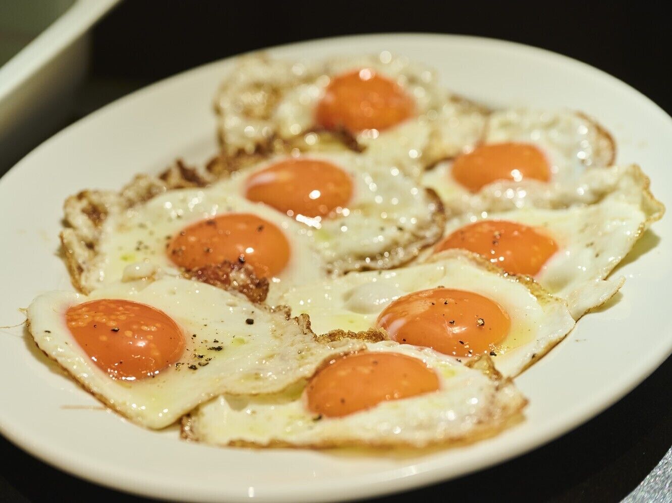 A plate of food with eggs and tomatoes on toast.