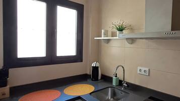 Fridge, microwave, stovetop, coffee/tea maker