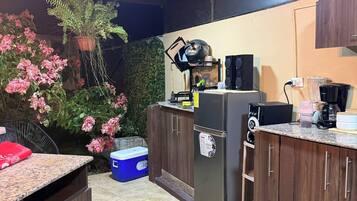 Fridge, stovetop, coffee/tea maker, cookware/dishes/utensils