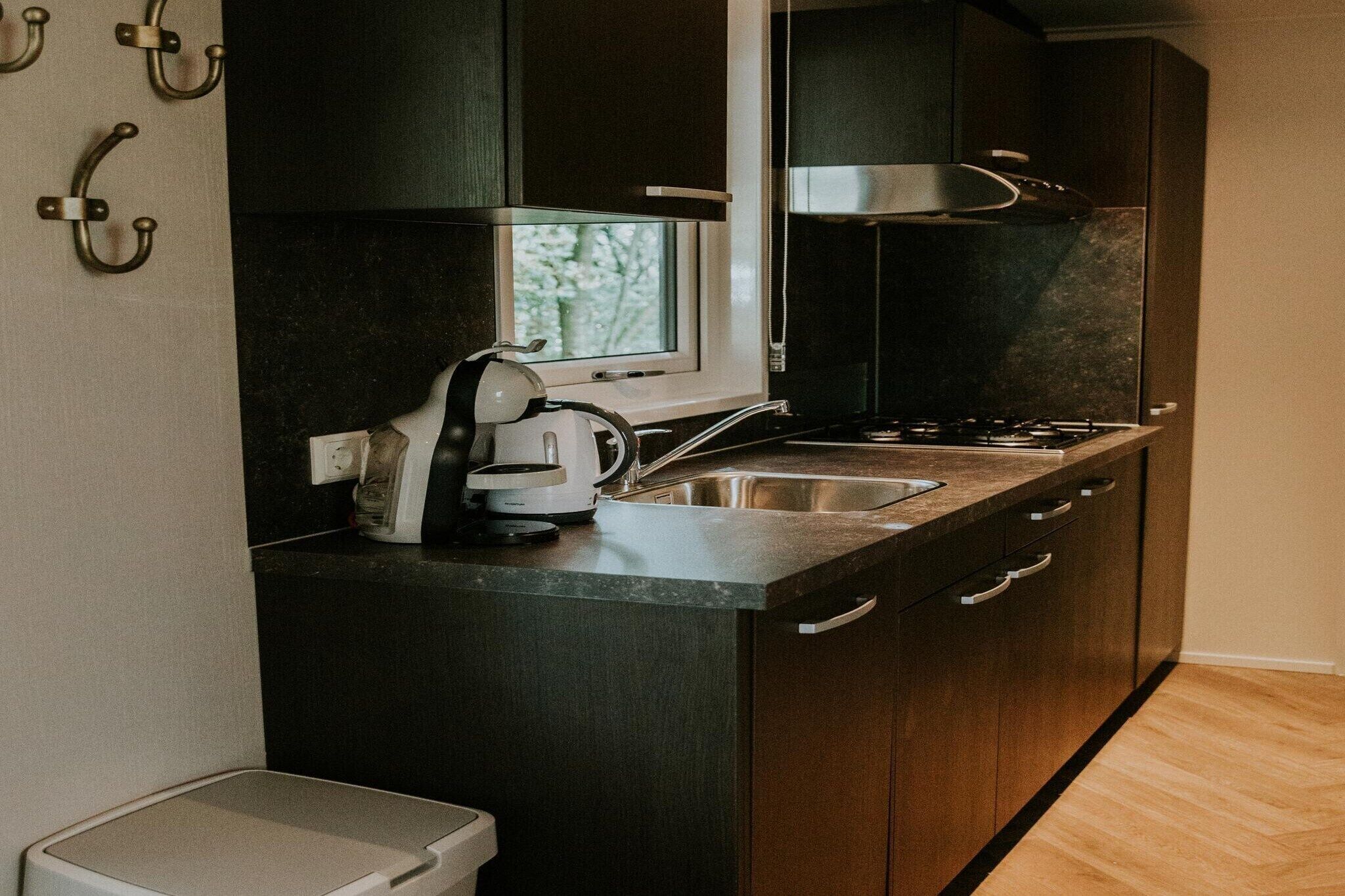 Fridge, stovetop, dishwasher, coffee/tea maker