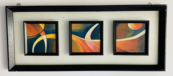 Three framed abstract paintings on a wall. - Grand Sea Shades Goa (Canacona)