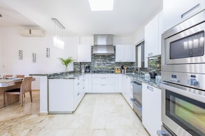 Villa, Golf View | Private kitchen | Highchair - Villa Desiree - Family Villa in Cocotal (Punta Cana)