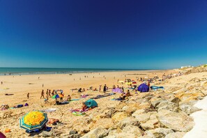 On the beach, sun-loungers