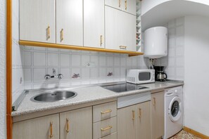 Fridge, microwave, stovetop, coffee/tea maker