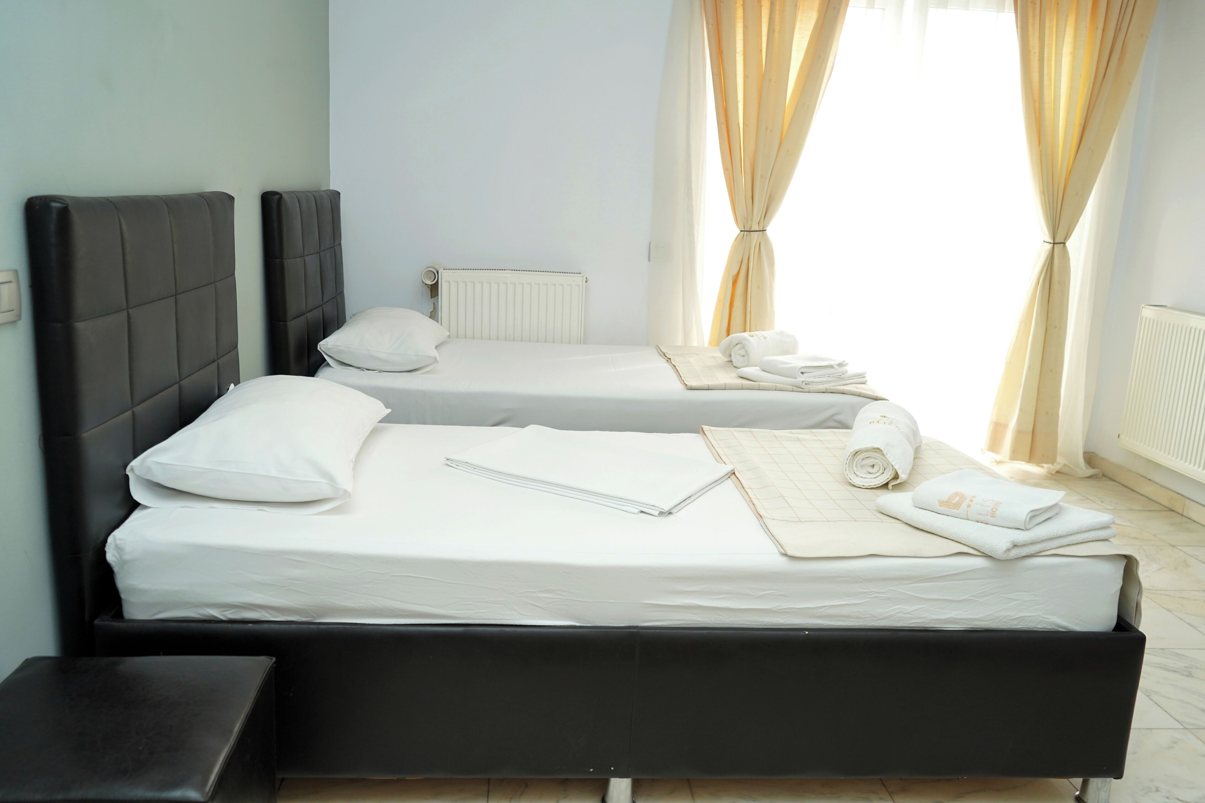 Family Quadruple Room, City View | In-room safe, desk, laptop workspace, soundproofing