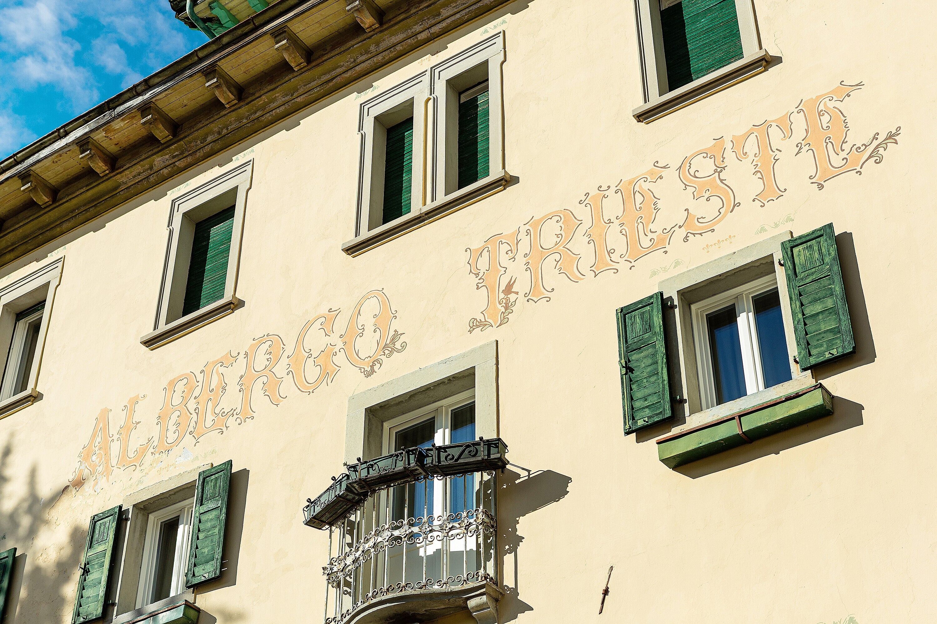 A building with the sign 'ALBERGO FRISTE' indicating a hotel.