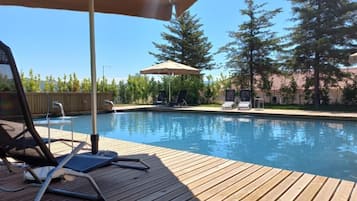 Seasonal outdoor pool, pool umbrellas, sun loungers