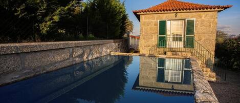 House, Balcony, Garden View | Pool | Seasonal outdoor pool, pool umbrellas, sun loungers