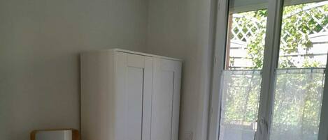 1 bedroom, desk, iron/ironing board, travel crib