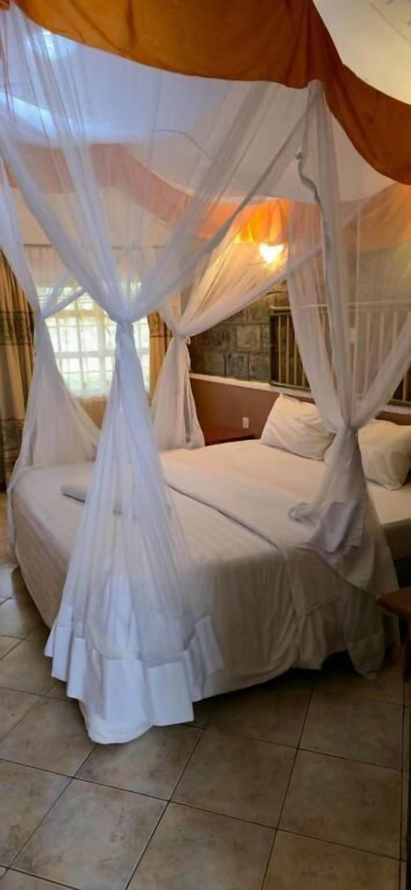 Habitación doble Deluxe, vista al jardín | Escritorio y espacio para trabajar con laptop 