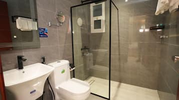 Junior Triple Room, City View | Bathroom | Shower, hair dryer, slippers, towels