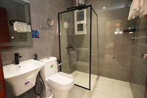 Junior Suite, City View | Bathroom | Shower, hair dryer, slippers, towels