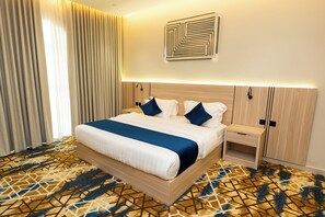 Family Suite | In-room safe, blackout drapes, iron/ironing board, free WiFi