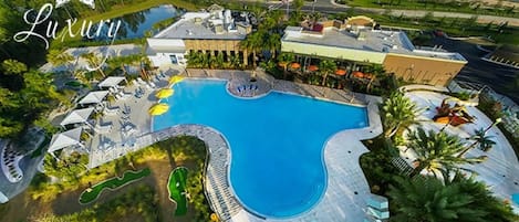 Vue aérienne d’un complexe hôtelier doté d’une grande piscine, de plusieurs espaces de détente et d’un parcours de golf.