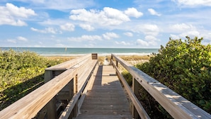 A wooden boardwalk leading to a beach with a clear sky. - Summer Days Cooler Nights #201 - 2nd Row Dog-Friendly House in Topsail Beach! (Topsail Beach)