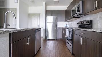 Apartment (1 Bedroom) | Private kitchen | Fridge, coffee/tea maker, dining tables