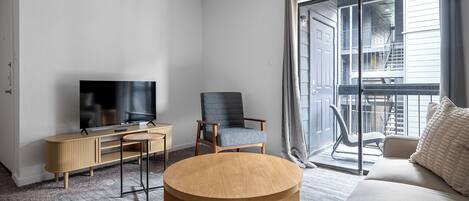 Apartment (1 Bedroom) | Living area | 50-inch TV with digital channels