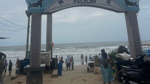 A beach entrance with a 'Welcome Palolem' sign, a sandy path, and people walking. - Palolem Sea n' Sand Beach View   (Canacona)