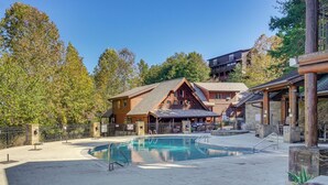 A wooden lodge with a pool, surrounded by trees and a clear sky. - 2 Mi to Dollywood! Golfview Resort Condo w/ Pools (Pigeon Forge)