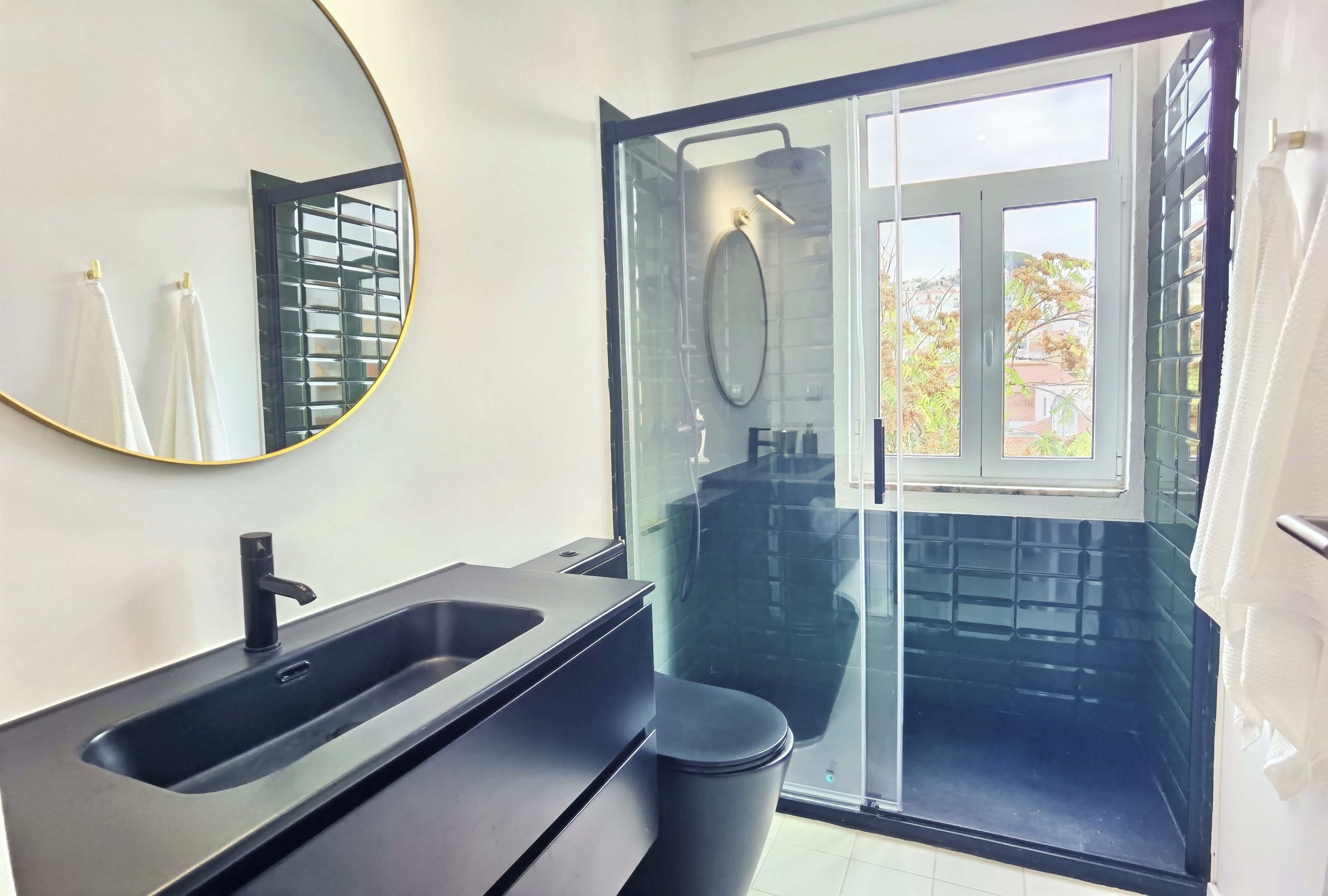 Shower, hair dryer, towels, toilet paper