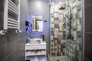 Shower, hair dryer, towels, soap