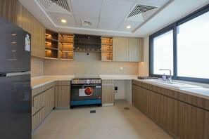 Villa, 4 Bedrooms, Beach View, Beachfront | Private kitchen | Fridge, microwave, oven, stovetop