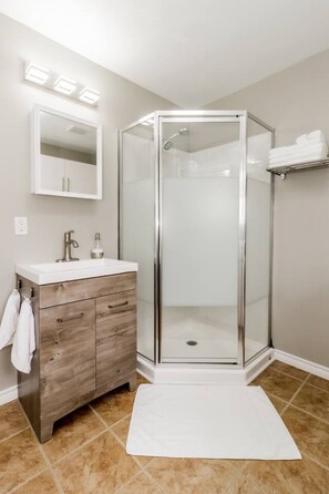 Shower, hair dryer, towels, toilet paper