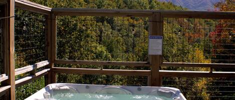 Cabin, 4 Bedrooms | Outdoor spa tub