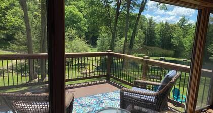 This beautiful Lodge in the woods is perfect for year round enjoyment!