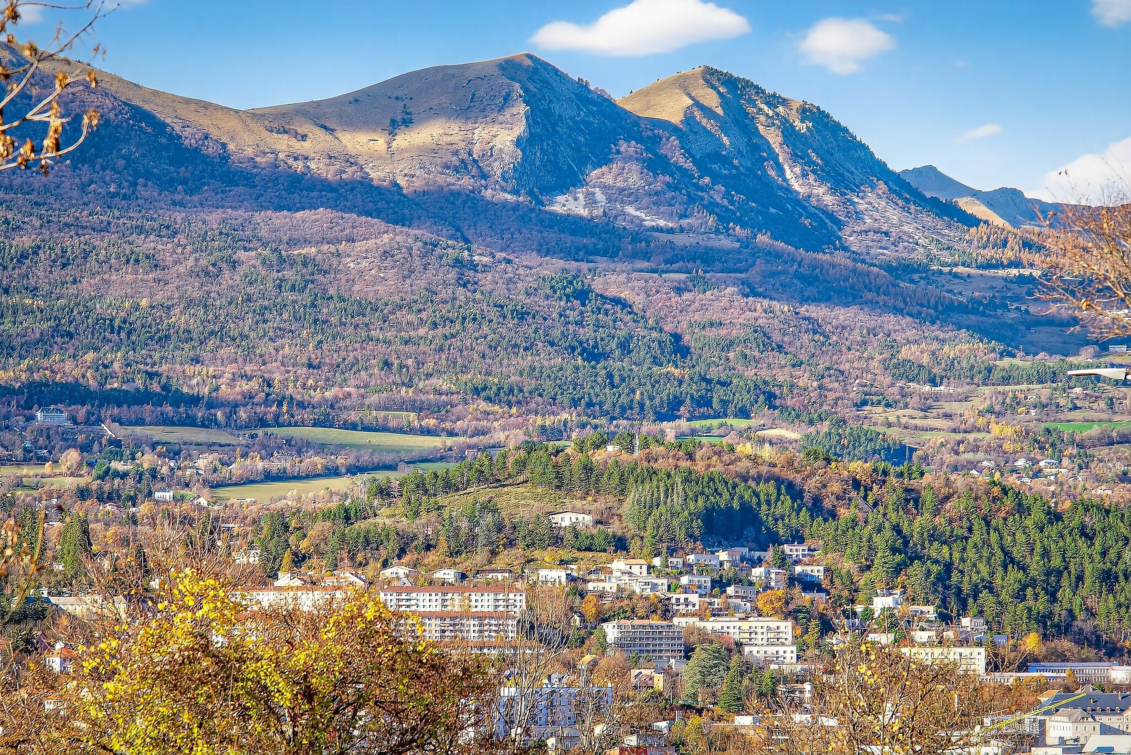 A mountainous landscape with a town in the valley.