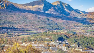 A mountainous landscape with a town in the valley.