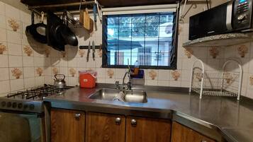 Fridge, microwave, cookware/dishes/utensils, spices