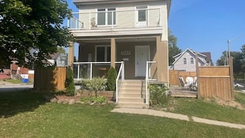 A two-story house with a front porch and a number 5269 on the door.