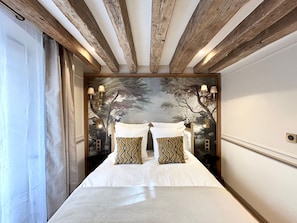 Hypo-allergenic bedding, pillow-top beds, in-room safe