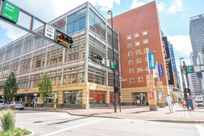 A modern building with large windows and a glass facade, labeled "Vision Hotel."