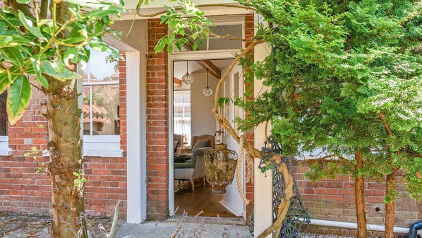 A rustic brick building with a wooden door leading to a cozy interior. - Edinburgh House - sleeps 8 guests  in 4 bedrooms (Burnham Market)